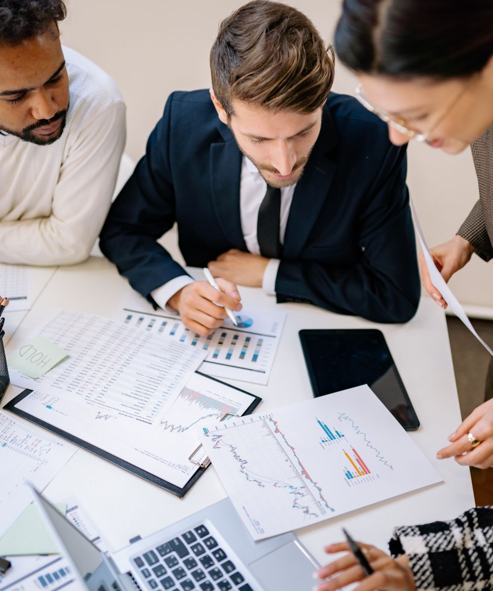 Leclair Team consultants collaborating over commercial analysis