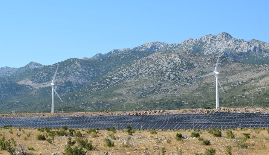 Wind turbines and solar panels across a sustainable energy landscape